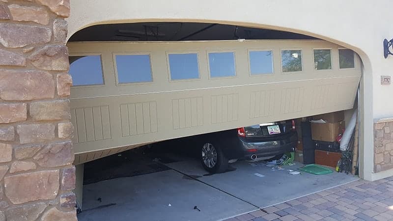 Garage door off track, exterior
