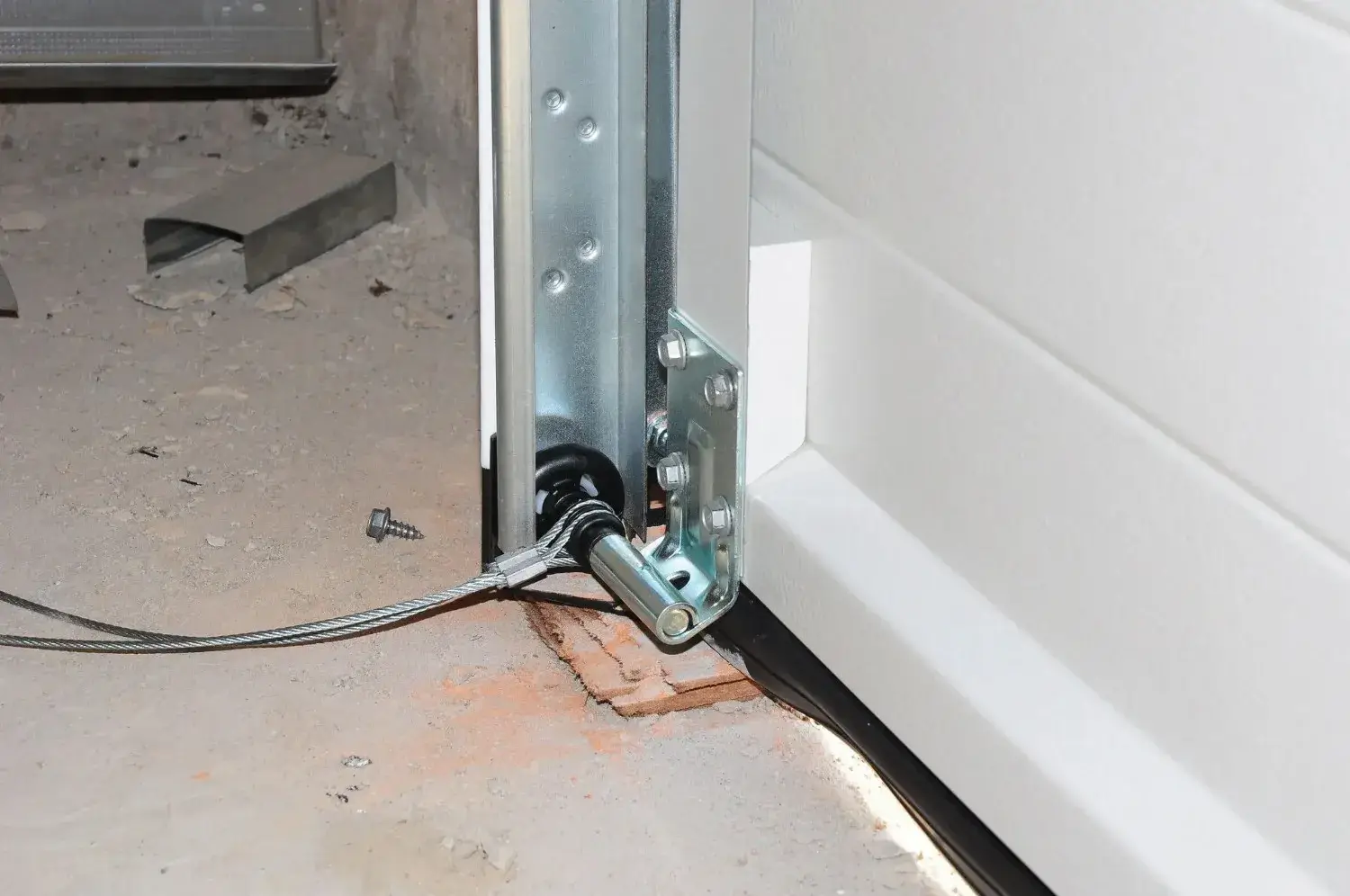 Garage door roller in its track, a common source of noise on older doors