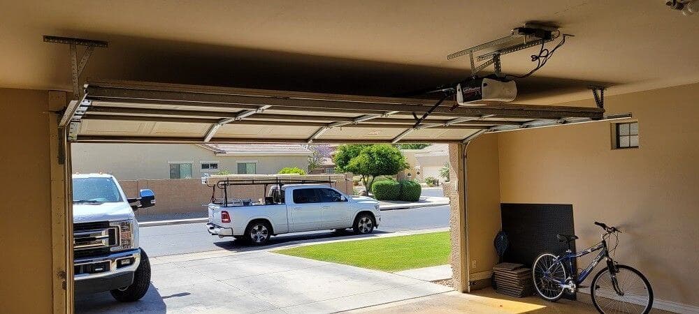 View from inside a garage looking out through an open garage door