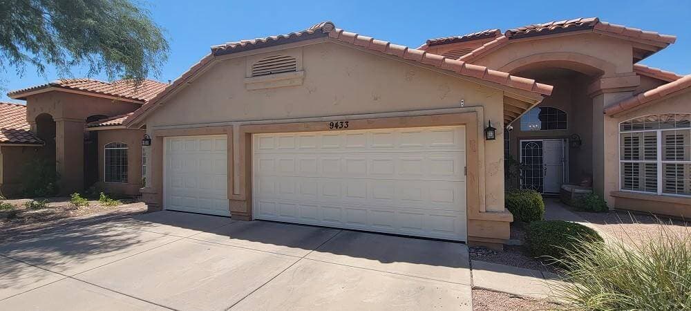 Double garage door on a stucco East Valley home