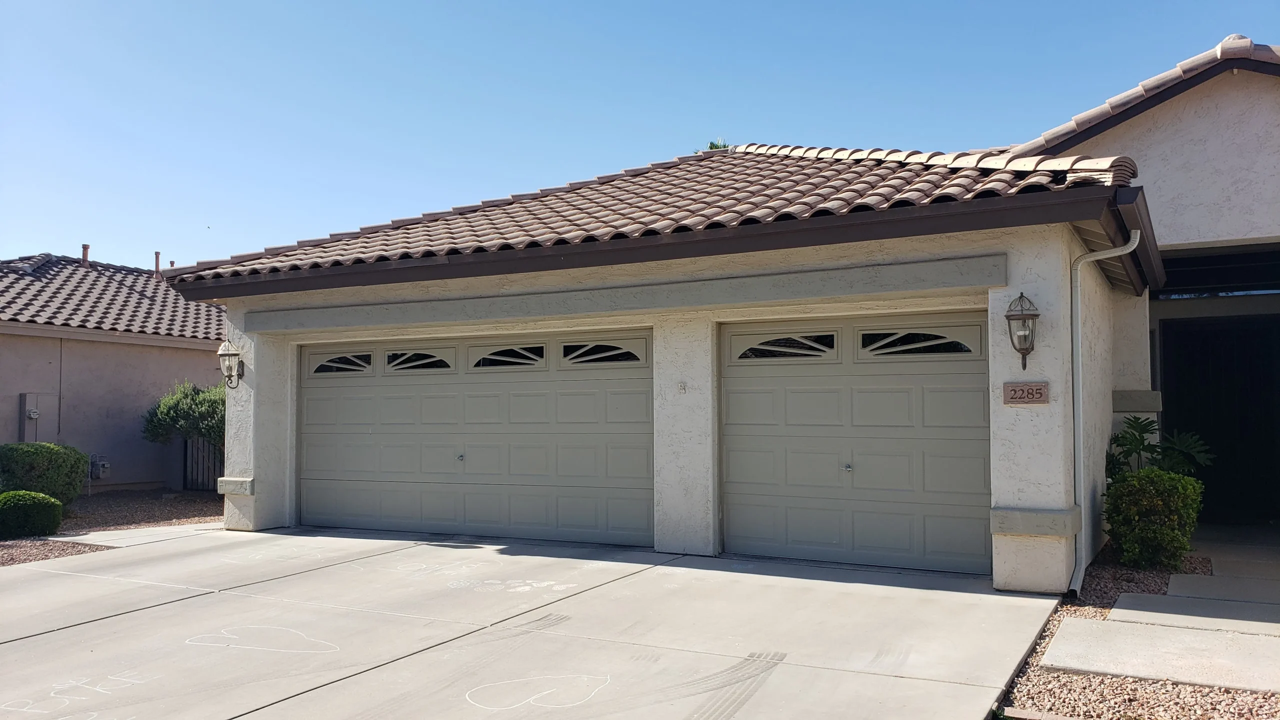 Traditional raised-panel garage doors that can over time experience common garage door issues