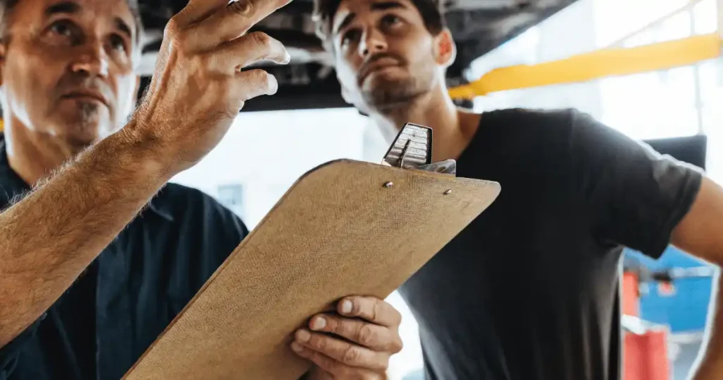 two people talking with clipboard
